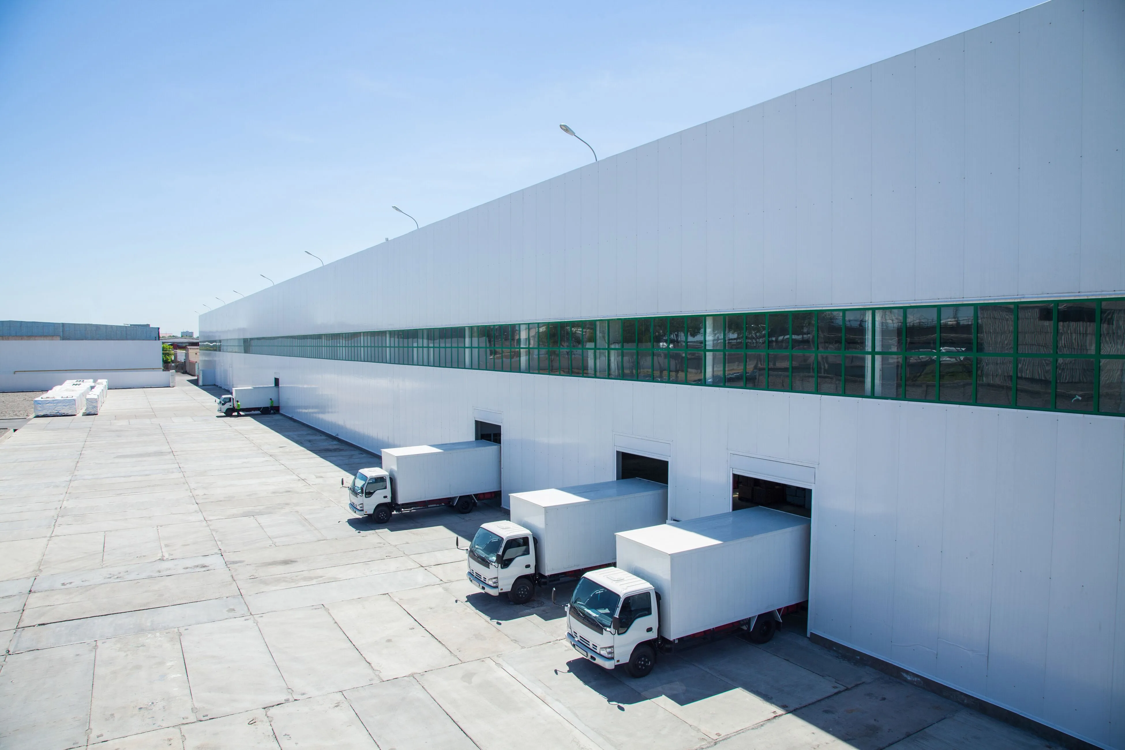 Property Image-stock facade of an industrial building and warehouse with freight cars in length.jpg
